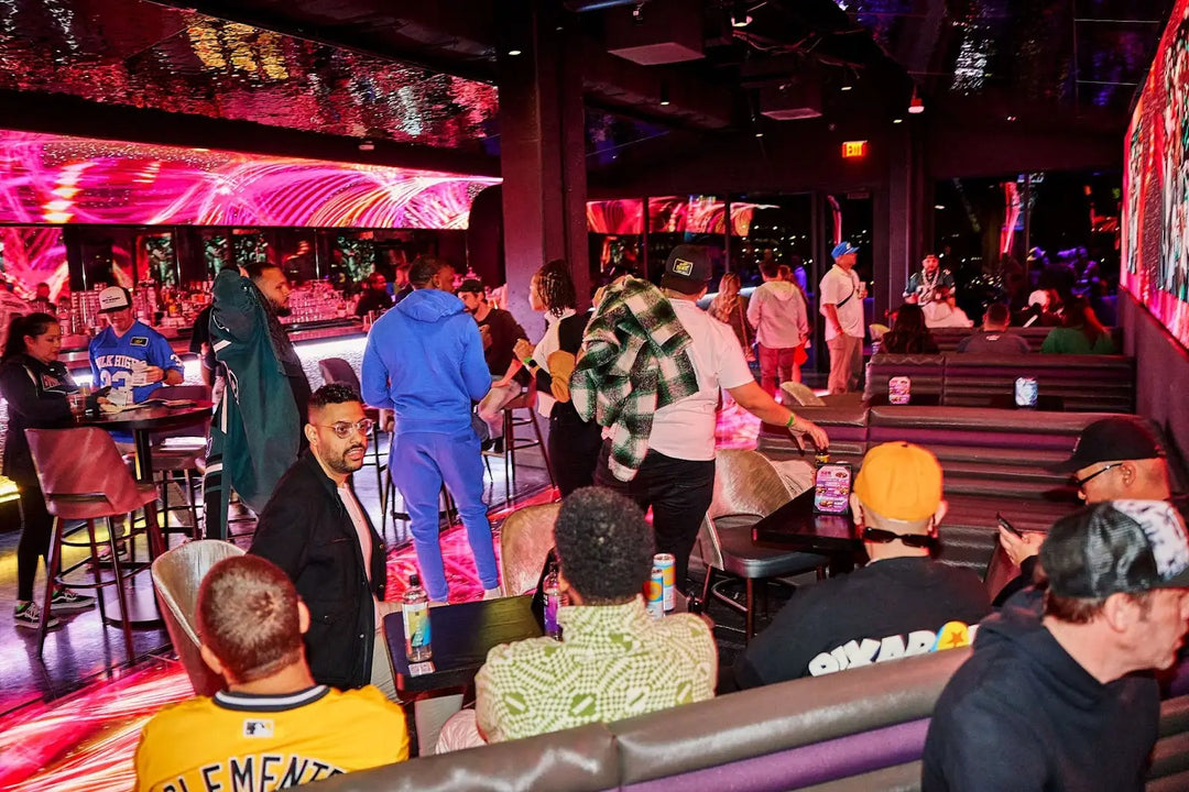 Group celebrating a birthday at Atomic Golf Las Vegas with golf games, signature cocktails, and a lively party atmosphere.