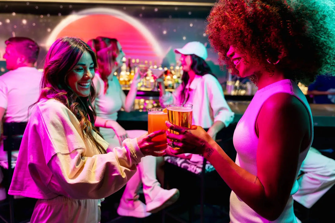 Group celebrating a birthday at Atomic Golf Las Vegas with golf games, gourmet food, and a lively VIP party atmosphere.