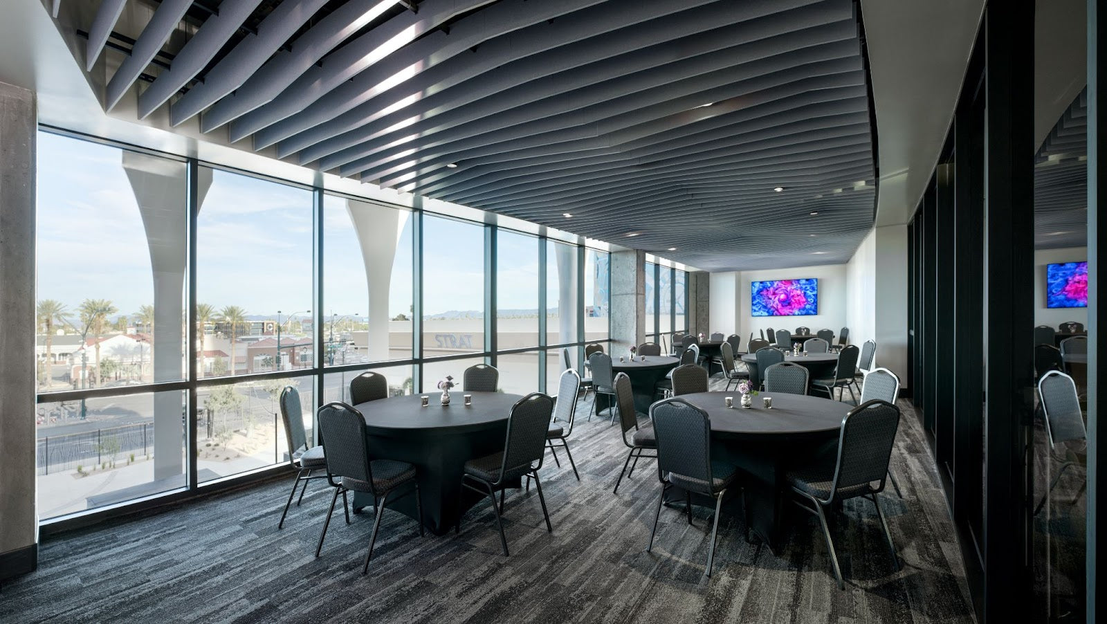 A lively Las Vegas restaurant with a large group enjoying food and drinks in a spacious setting.