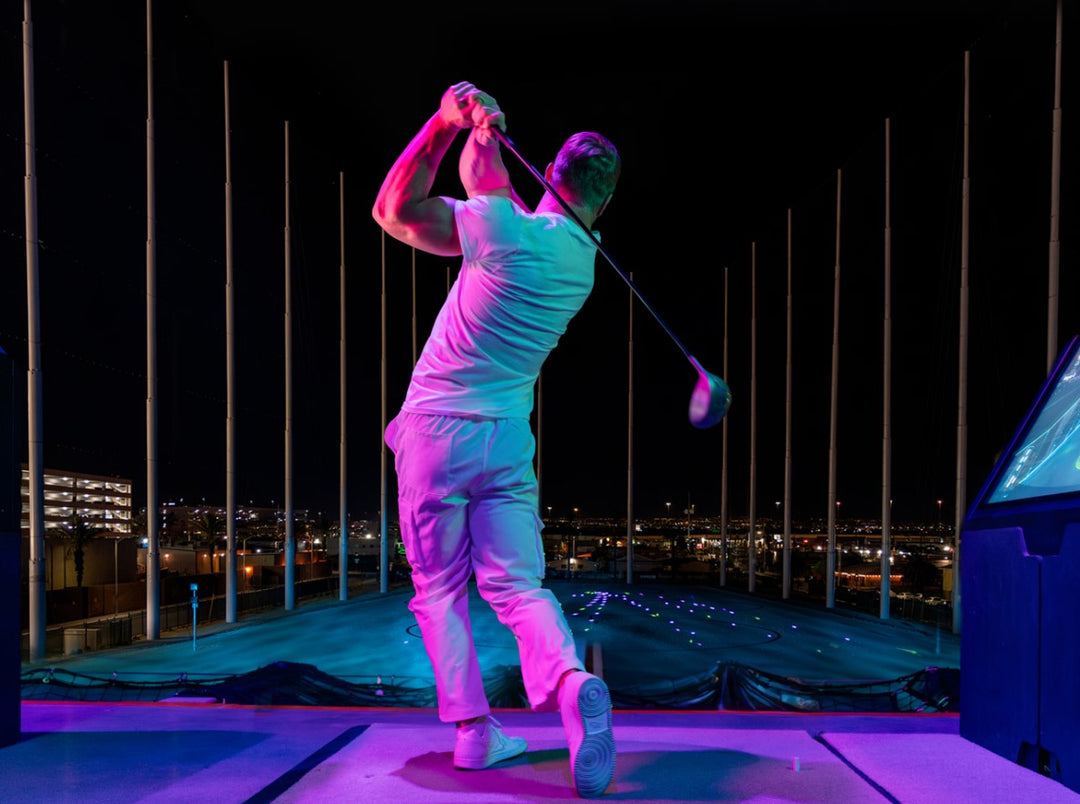 Atomic Golf’s high-tech hitting bays with a view of the Las Vegas skyline.